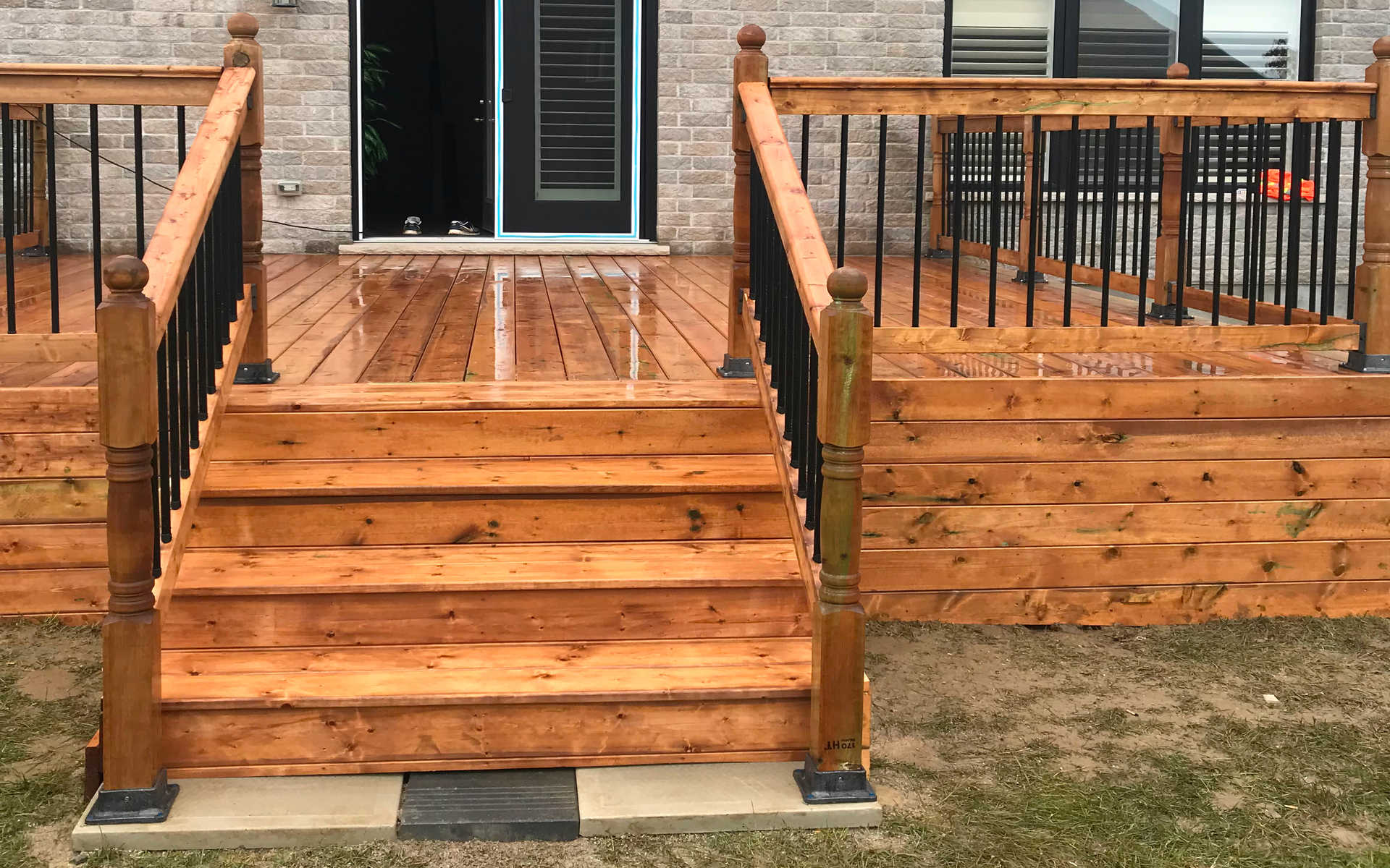 Wooden deck, solid wood or cedar deck / patio. London Ontario wood construction / installation project by Brothers Construction 3, a home renovations contractor.